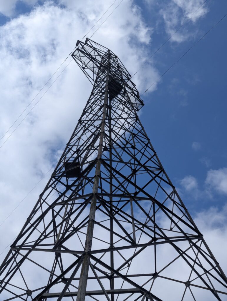 Picture tilted up at a pylon, the sky seems quite dramatic
