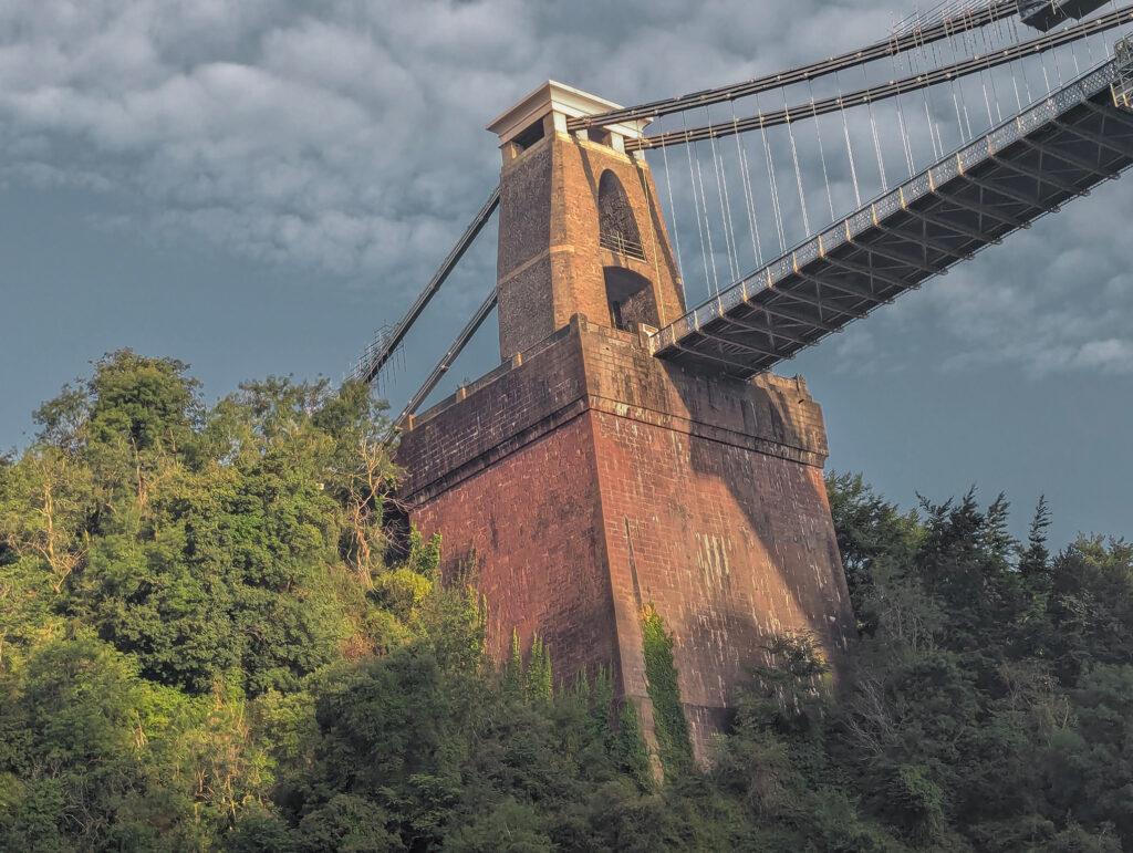Clifton suspension bridge in Bristol, the sky looks incredibly moody and the image is taken at an angle.